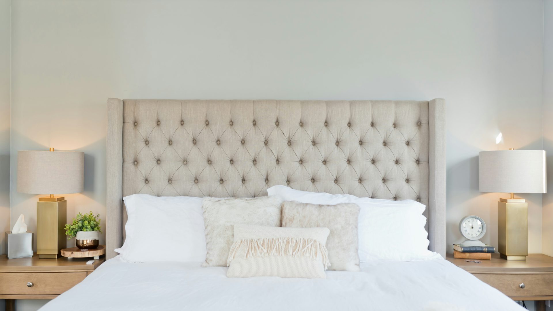 white bed linen with white pillows