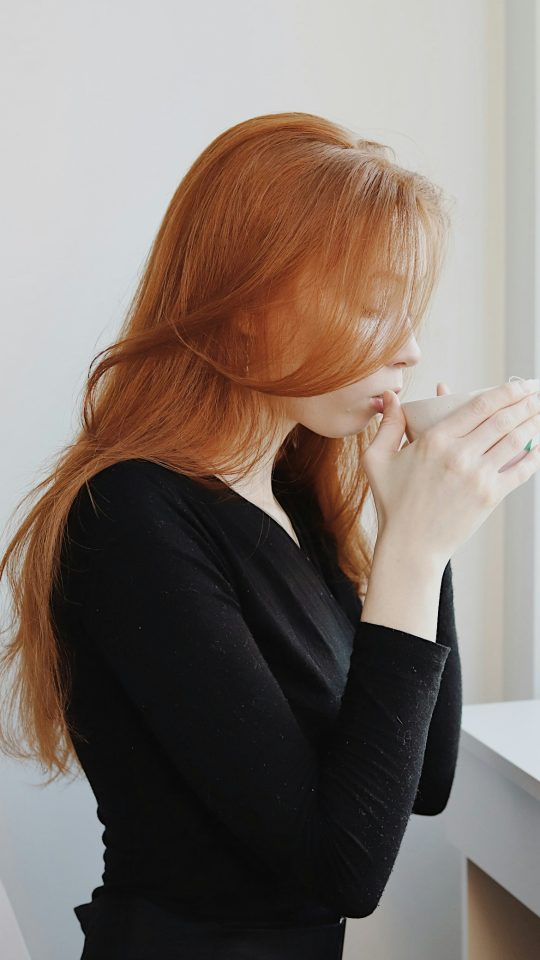 woman in black long sleeve shirt sitting on chair